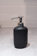 black cosmetic bottles isolated on white