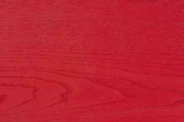 Texture of red wood. The large textured wood of the ash tree is painted red. Red ash wood.