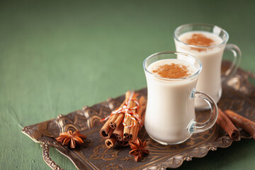 Turkish traditional hot drink salep on green background. Copy space