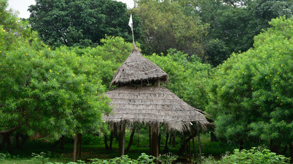 Small bamboo hut on the park for resting between the nature trail in India