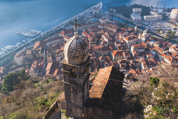 Church of Our Lady of Remedy in Kotor, Montenegro, beautiful top panoramic view of Kotor city old medieval town seen from San Giovanni St. John Fortress, with Adriatic sea, bay of Kotor and mountains