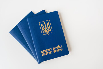 Ukrainian passport on a white table. Passport of a citizen of Ukraine. Inscription in Ukrainian Passport of Ukraine.