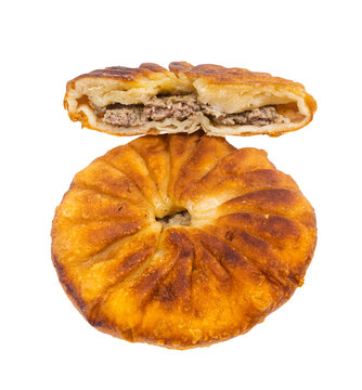 Tatar cuisine - one and half Peremech ( fried pastry stuffed with minced meat) isolated on white background