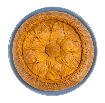 Tatar cuisine - above view of Zur Belish Tatar Big Pie (close baked pie from unleavened dough with meat and potato fillings) on plate isolated on white background