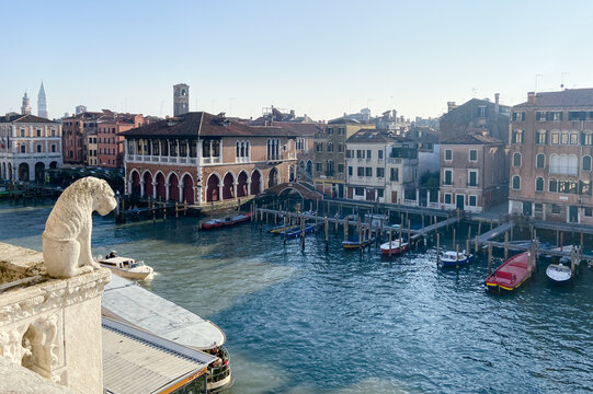 view of Grand Canal with mooring boats from Rialto Bridge in Venice city on sunny winter moning