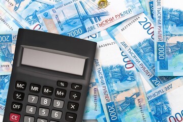 Economy financial concept, calculator on paper currency.