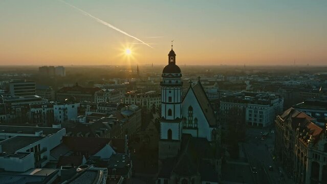 Drone shot of St. Thomas Church (Thomaskirche) at sunset , Leipzig , Saxony, Germany