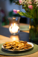 Smal mini pancakes on the table with tulpans, spring colors