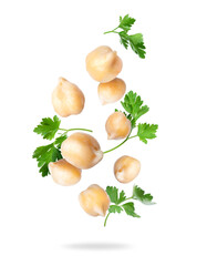Chickpeas with parsley leaves close up in the air isolated on a white background