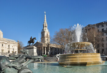 Fountain with water spray, St Martin-in-the-Fields Church and Equine Statue, Trafalgar Square,...