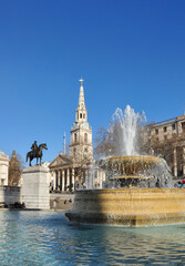 Fountain with water spray, St Martin-in-the-Fields Church and Equine Statue, Trafalgar Square,...