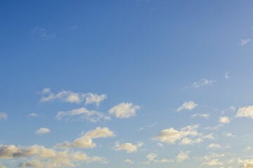 Naklejka na ściany i meble Beautiful view of white clouds on blue sky background. 
