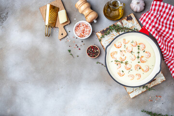 shrimps, bechamel sauce and parmesan in pan. banner, menu, recipe place for text, top view