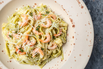pasta fettuccine or tagliatelle with seafood rich cream. Cooking mediterranean food with savory prawns,Restaurant menu, dieting, cookbook recipe top view