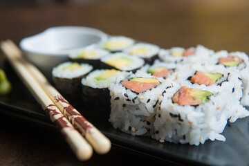 delicious rolls of rice with fish or makis, with their oriental chopsticks