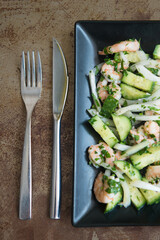 delicious plate of green salad with cucumbers ready to eat