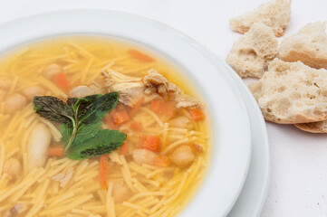 delicious noodle soup with peppermint and chicken