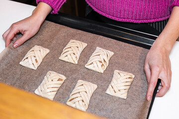 Woman Preparing Raw Buns on Baking Sheet Homemade, Fresh, and Delicious Pastry for Baking and Sharing