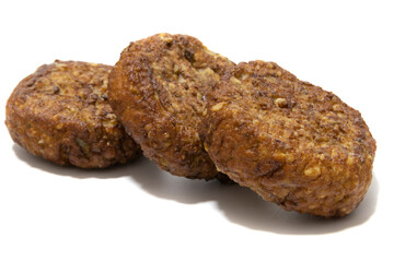 Frikadellen (squashed meatballs) isolated on a white background. German food concept.