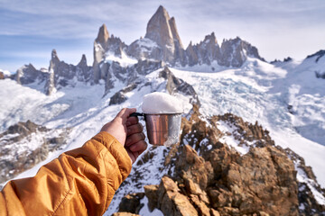 cup full of snow on top of cerro madsen, patagonia argentina