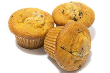 Muffins with chocolate flecks isolated on a white background. Muffins are made mainly from wheat flour, egg, vegetable oil, cow's milk, baking powder, essence (vanilla being the most common) and sugar