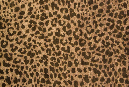 Leopard effect, background fabric sample. Leopard print repeat image. Animal skin texture fabric pattern. Jaguar skin background.