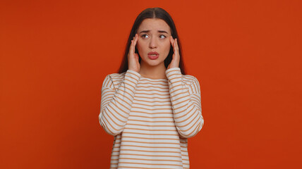 Hipster young pretty woman in pullover rubbing temples to cure headache problem, suffering from tension, migaine, stress, grimacing in pain, high blood pressure isolated alone on red wall background