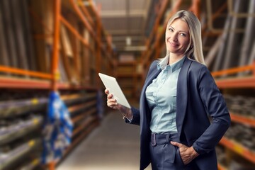 Happy young smart woman posing with digital tablet