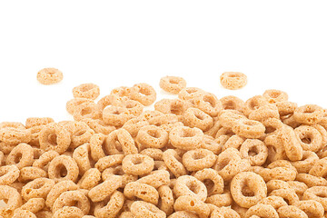 Breakfast cereal sweet rings isolated on a white background, front view. Pile of oat cereal.