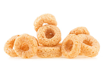 Pile of oat cereal rings isolated on a white background. Healthy breakfast for kids.