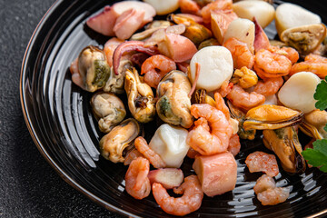 seafood salad shrimp, mussel, scallop, octopus healthy meal food snack on the table copy space food background rustic top view pescatarian diet
