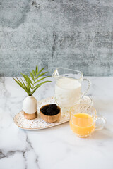 Orange juice and berries with milk