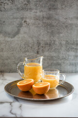 Orange juice on silver tray
