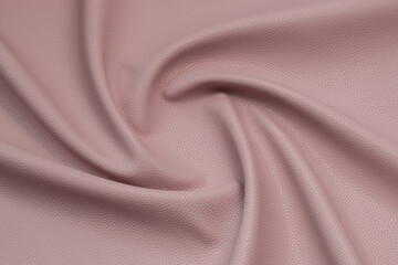 pink artificial leather with waves and folds on PVC base