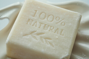 Homemade natural soap bar on black background 