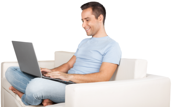 Smiling Man Using Laptop while Lying on a Couch - Powered by Adobe