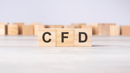 CFD - word concept written on wooden cubes or blocks on a light background