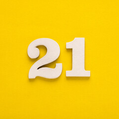 Number 21 on a yellow background - Two-digit number in white