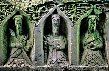 Jerpoint Abbey, County Kilkenny, Ireland. Stone carved Christian saints known as the weepers on the side panel of 16 C. tomb - obrazy, fototapety, plakaty