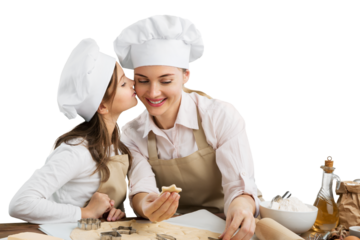 Little girl and her beautiful mother cooking on the kitchen