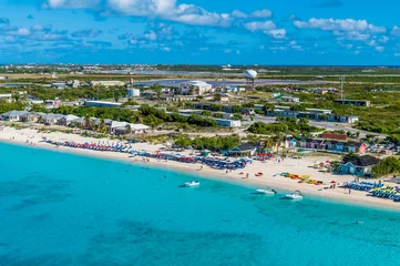 Foto op Plexiglas An aerial view over a resort and airport on the island of Grand Turk on a bright sunny morning © Nicola