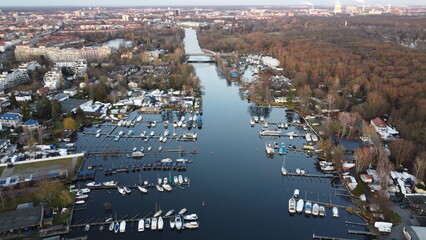 Aerial view of a city rier with lots of docked boats