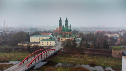 Aerial view of a red bridge with an old chruch