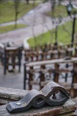 Decorative element on the old staircase made of steel and wood in the park of the city of Chernihiv, an old staircase in the park area