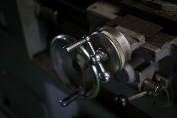 Naklejka premium A handle that turns an axis on a lathe 