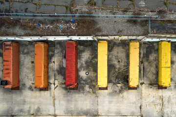 Top-down of shipping containers outside of a warehouse