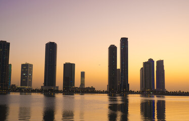 Fototapeta premium Night landscape of the embankment of the emirate of Sharjah, United Arab Emirates