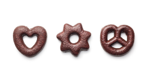 Sweet chocolate heart, star and pretzel isolated on white background.