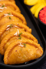 Saffron Gujia Also Called Kesar Gujiya, Pirukiya, Pirukia, Pedakiya, Karanji, Basundi Or Gughra Stuffed With Mawa, Khoya, Chasni, Mava - Indian Sweet Dumpling For Deepawali, Teez, Holi, Diwali, Teej