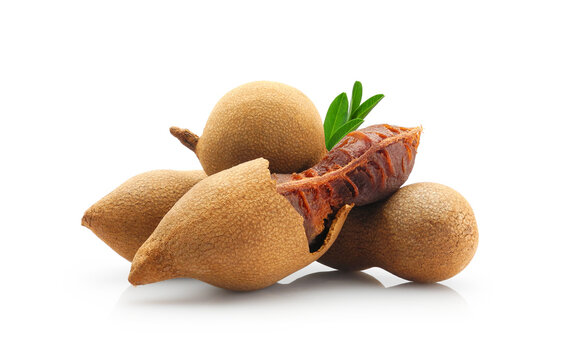 Sweet tamarind fruits whole and peeled close-up isolated on white background